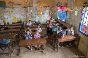 western kids visiting a school in the floating village of kampong phluk