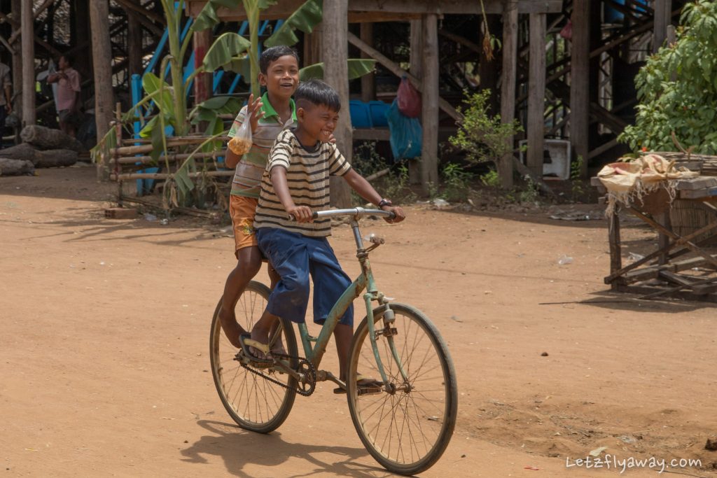 boys on a bike in kampong phluk