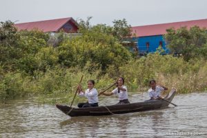 Cambodian kids going to school in the floating village