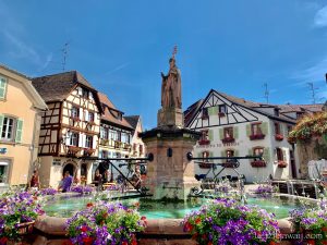 Eguisheim fountain in summer